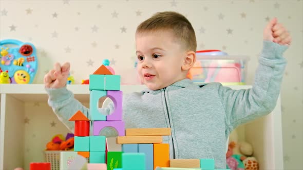 The Child Plays with Toys in the Room