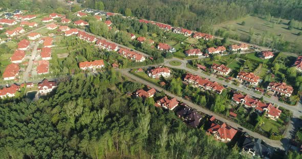 Aerial view of a new housing estate in the suburbs, drone flying around.