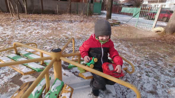 Boy Spinning On A Carousel Slow Motion