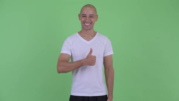 Happy Handsome Bald Man Giving Thumbs Up