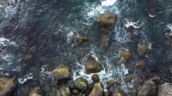 Splashing Sea Waves on the rocky beach in Norway