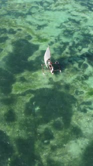 Boat Boats in the Ocean Near the Coast of Zanzibar Tanzania Slow Motion Vertical Video