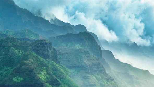 Na Pali Coast Park with Green Mountain Peaks Covered By Dramatic Rain Clouds USA