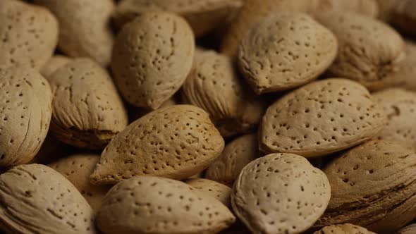 Cinematic, rotating shot of almonds on a white surface - ALMONDS 145