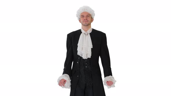 Man in Oldfashioned Laced Frock Coat and White Wig Walking in a Mannered Way Looking at Camera on