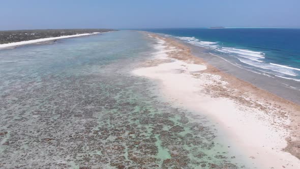 Ocean Coastline and Barrier Reef at Low Tide Zanzibar Matemwe Aerial View