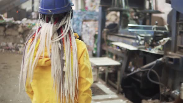 Womanworker in Yellow and Transparent Protecting Glasses Hard Hat and Mask Working with Equipment on