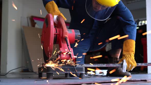 Professional Mechanic is Cutting Steel Metal