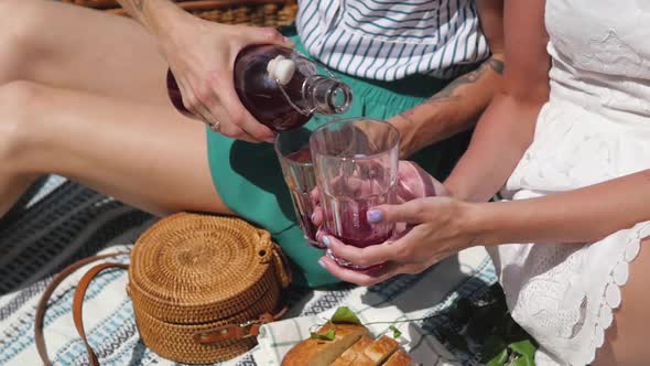 Summertime Picnic Setting on the Grass with Open Picnic Basket Fruit Salad and Cherry Pie