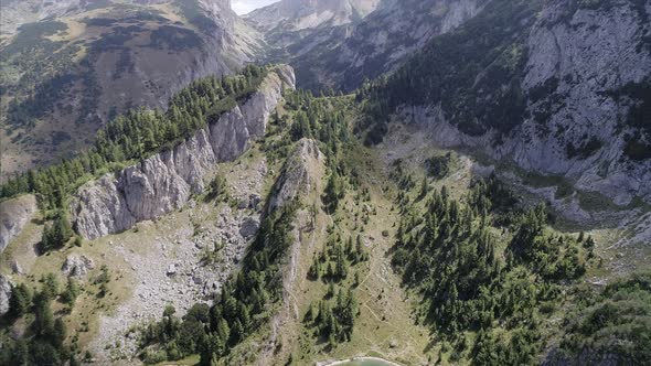 Tilt Up of Rugova Lake and Rugged Mountains in Kosovo