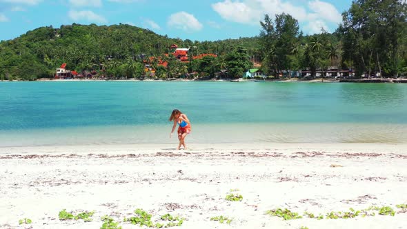 Girls happy and smiling on tranquil bay beach lifestyle by blue lagoon with white sand background of