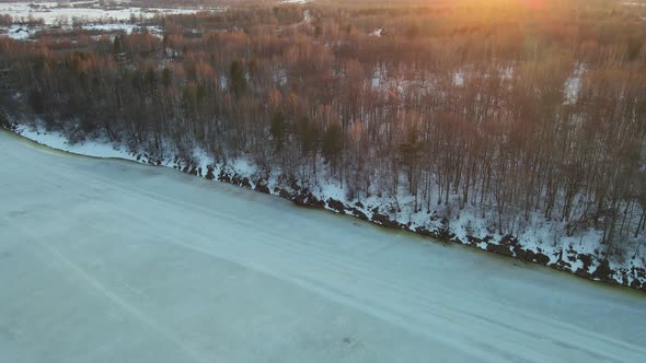 Perfect Winter Landscape with Frozen River at Sunset Aerial View