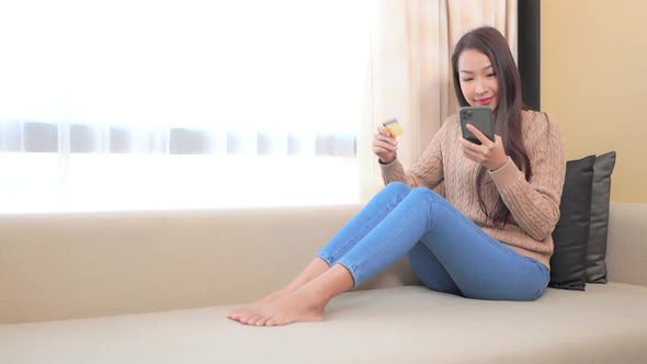 Young asian woman use smart phone