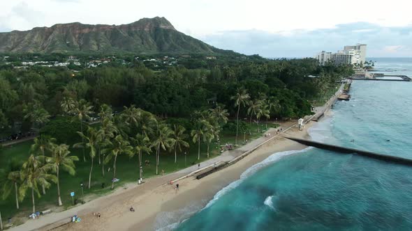 Drone over Waikiki Beach featuring Diamond Head, just before sunset,gentle Waves and Palm Tress movi