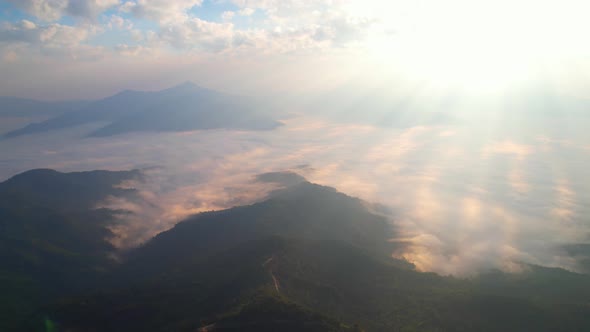4K Aerial Flying Above Fog at Sunrise
