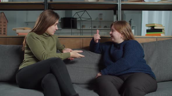 Happy Females Talking Using Sign Language Indoors