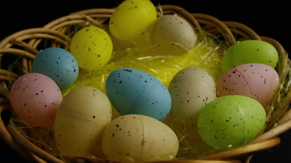 Rotating shot of Easter decorations and candy in colorful Easter grass - EASTER 047