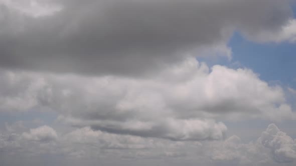 blue sky with clouds, moving clouds in the sky