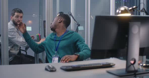 Young Men Working in Data Center