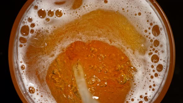 Super Slow Motion Detail Shot of Pouring Beer Into Glass at 1000Fps