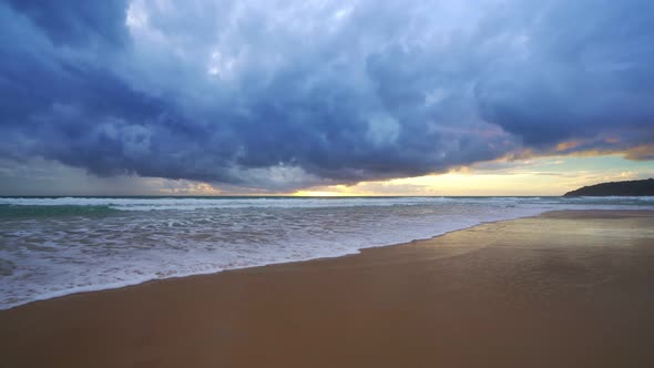 Raining and Dark huge cloud sky black stormy over phuket island and sea wave crashing on sandy shore