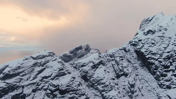 Drone Over Hiker On Top Of Snowy Mountain