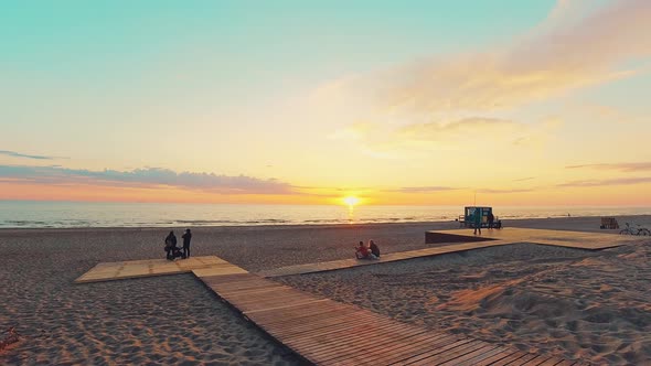 Sunset Timelapse Baltic Sea Coast With Tourists