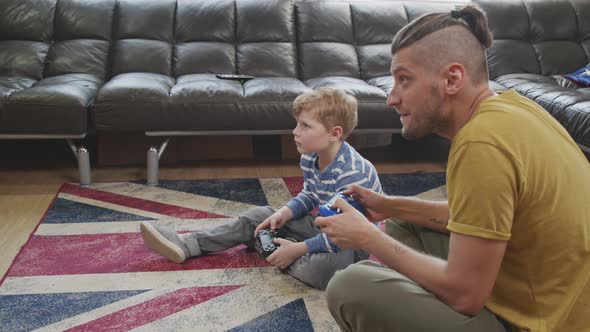 Slowmo of Father and Son Playing Video Game