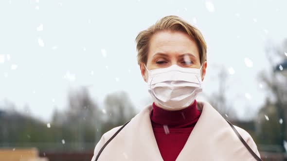 Woman Wearing Protective Medical Mask in Winter