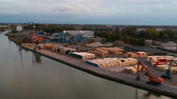 Lowering from a high angle over a lumberyard