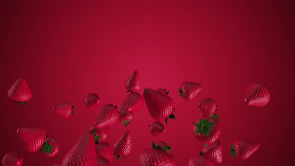 THE MOVEMENT of fresh strawberries falling on a red background.