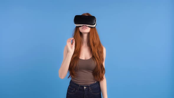 Redheaded Female in VR Headset Brown Shirt and Jeans