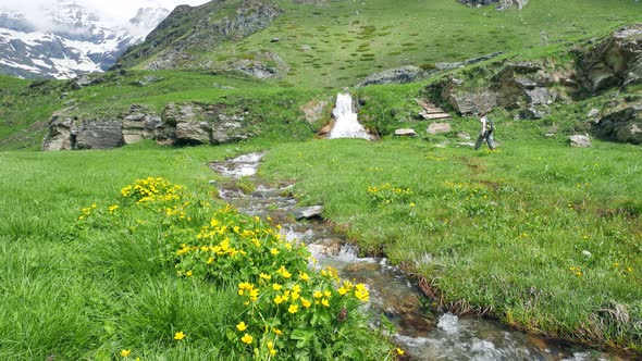 Woman Backpacker hiking in idyllic landscape