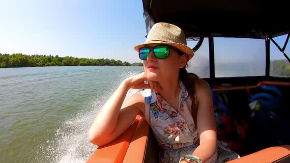 Beautiful Woman Enjoying a boat ride on Danube River, Romania