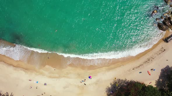 Aerial top down abstract of relaxing seashore beach lifestyle by shallow sea and white sandy backgro