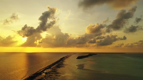 Aerial flying over scenery of perfect coast beach vacation by clear ocean and white sand background 