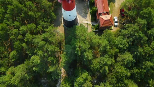 Aerial close-up view of Stilo Lighthouse and green forest around it - lighthouse located in Osetnik