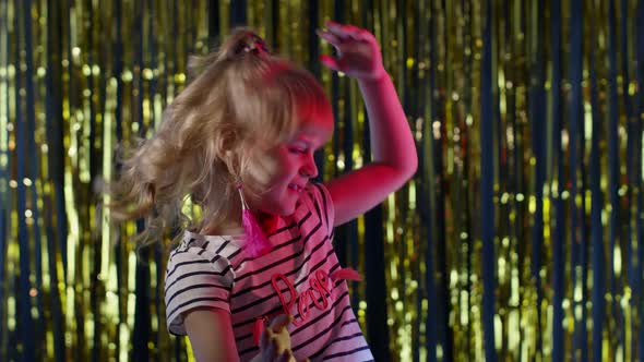 Teen Kid Girl Listening To Music Dancing Energetic Rhythm Shaking Head in Slow Motion at Disco Club
