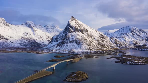 Fredvang Bridge and Volandstind Mountain in Winter. Lofoten, Norway. Aerial View