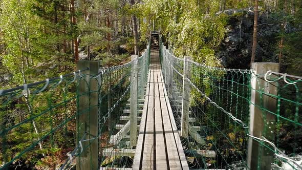 Walking on the Suspension Bridge in Oulanka National Park in Finland