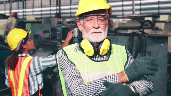 Senior Factory Worker or Engineer Close Up Portrait in Factory