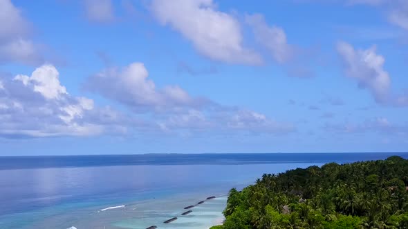 Aerial drone travel of shore beach time by clear lagoon with sand background