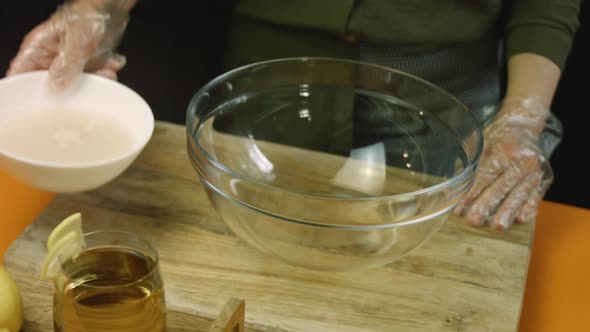 Pour the Water with Yeast Into the Transparent Bowl