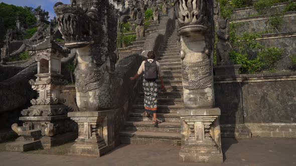 Slowmotion Shot of a Man Tourist Visiting the Pura Lempuyang Temple at the Bali Island, Indonesia