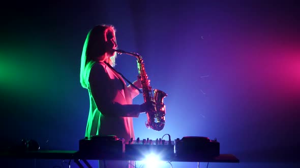 Young Sexy, Blonde Woman Dj in White Jacket and Black Top Playing Music Using Saxophone, Flipping