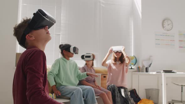 Schoolchildren Using VR Goggles in Classroom