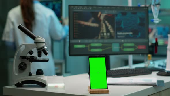 Display Phone with Mock Up on Template Placed on Desk in Scientific Lab