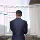 Businessman Looks to Gantt Chart, Project Schedule Harmonogram Work Processes - VideoHive Item for Sale