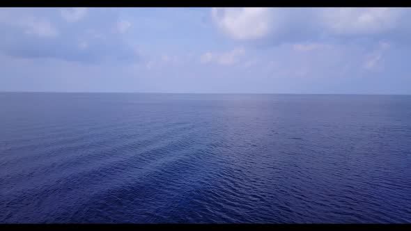 Aerial landscape of luxury tourist beach vacation by transparent water and white sand background of 