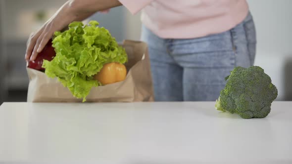 Lady Taking Vegetables from Grocery Bag, Putting on Table, Healthy Eating, Diet